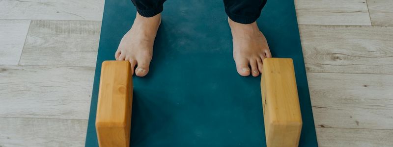 Close-up of a high quality yoga mat and blocks.